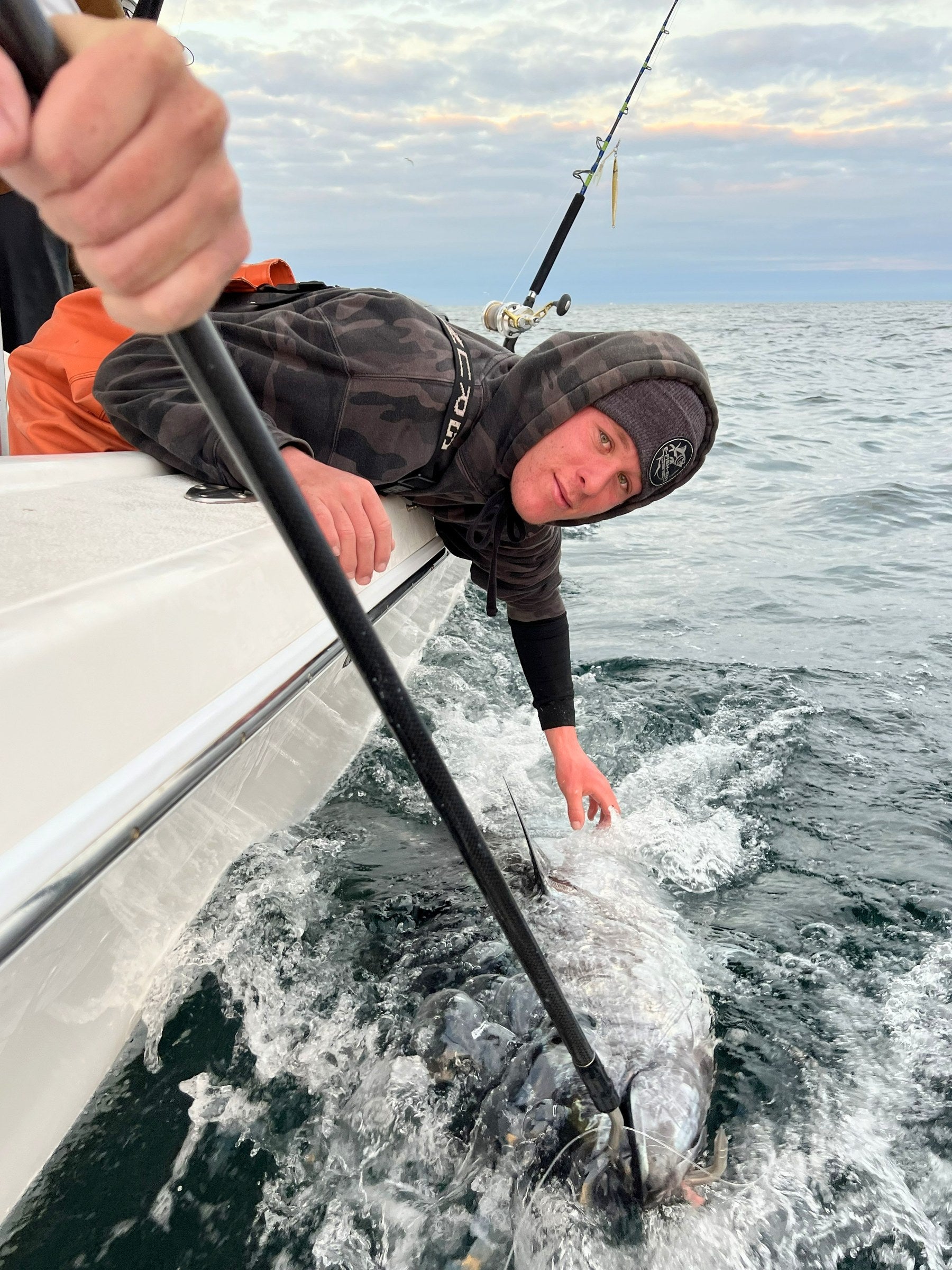 Gaffing a tuna boatside with a carbon fiber gaff