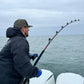 Angler fighting a fish on a Giant Bluefin Series bent-butt rod
