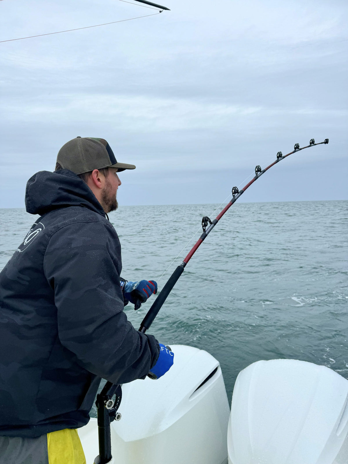 Angler fighting a fish on a Giant Bluefin Series bent-butt rod
