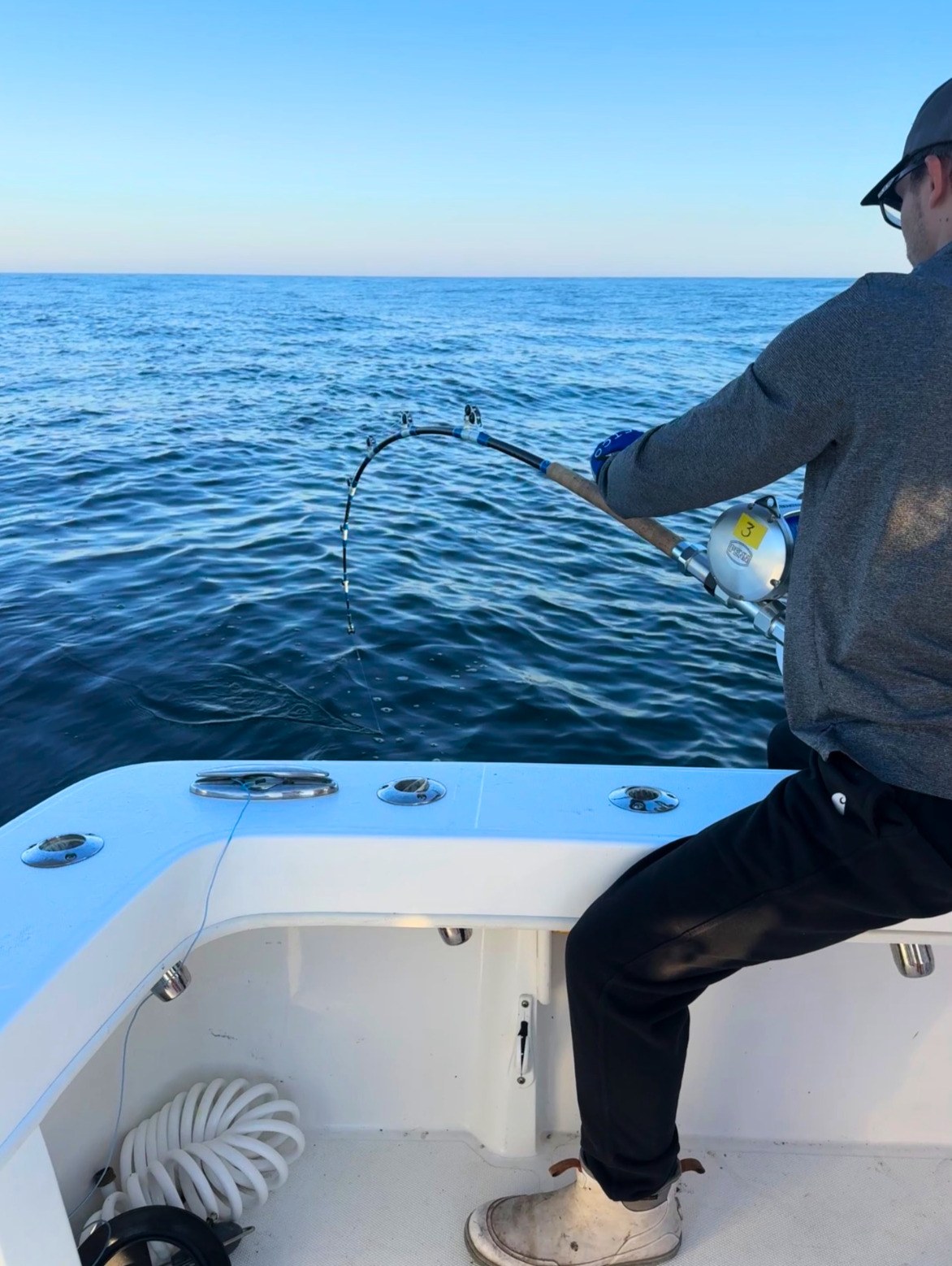 Giant Bluefin Series rod loaded up, angler braced on deck