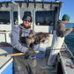 Angler with a tautog caught on an Inshore Reaper rod