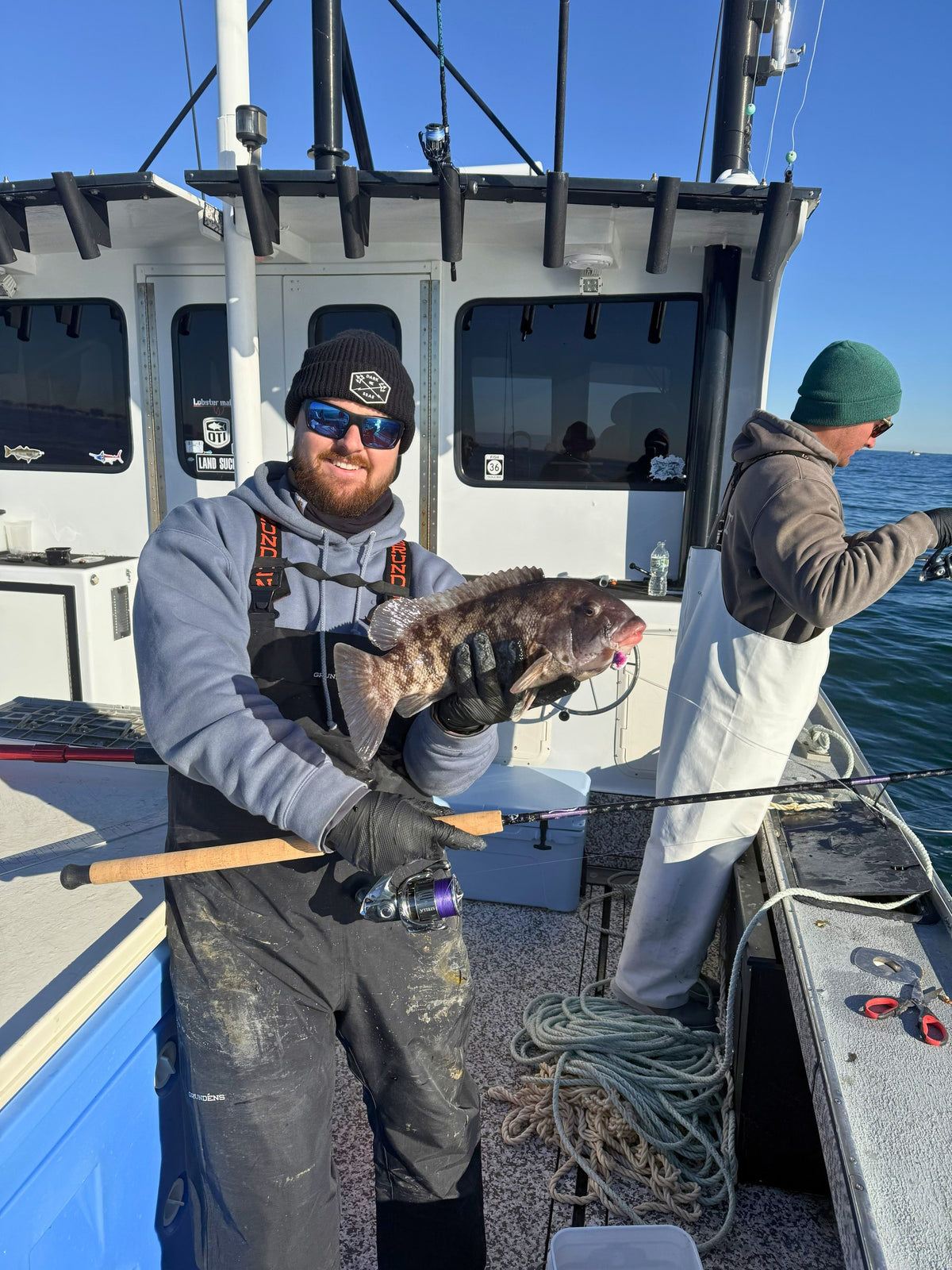 Angler with a tautog caught on an Inshore Reaper rod