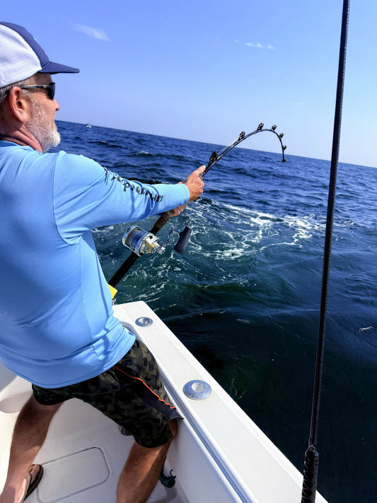 Angler fighting a fish on an Offshore Trolling Series roller-guide rod