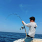 Angler leaning into a bent Pelagic Sniper spinning rod
