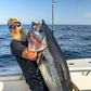 Angler holding a bluefin tuna caught on a Pelagic Sniper rod