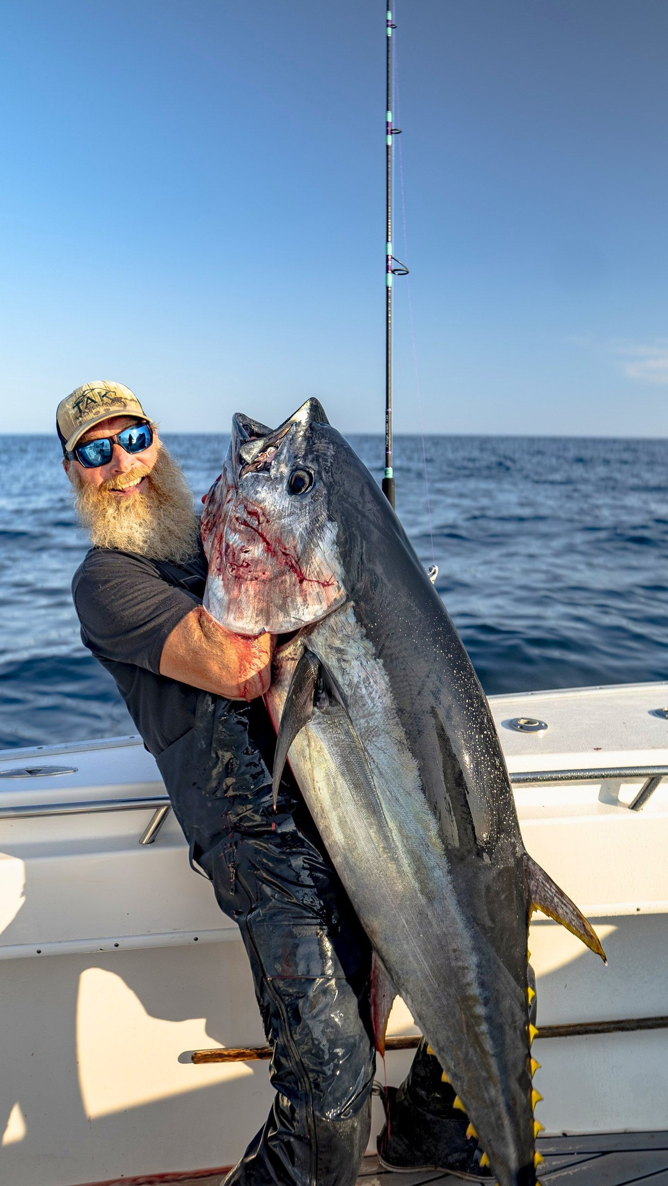 Angler holding a bluefin tuna caught on a Pelagic Sniper rod