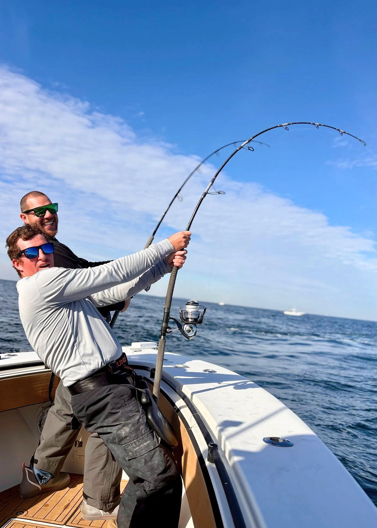 Two anglers on the bow, Pelagic Sniper spinning rod loaded up