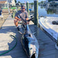 Bluefin tuna on the dock with the Phantom Jigger rod that caught it