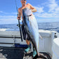 Angler holding a tuna caught on a Phantom Jigger rod