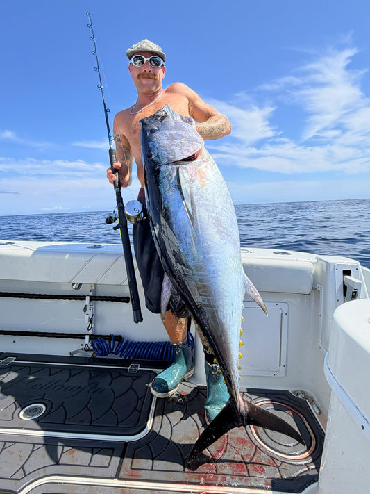 Angler holding a tuna caught on a Phantom Jigger rod