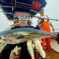 Crew with a bluefin tuna on deck caught on a Vert Giant jigging rod